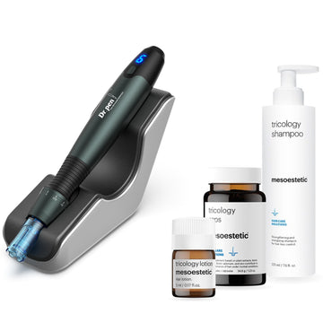 Dr. Pen A20 microneedling pen on its charging stand with mesoestetic tricology lotion, caps and shampoo
